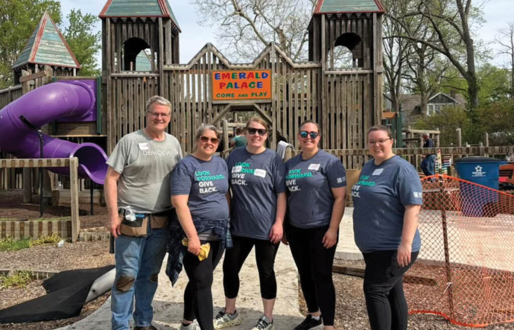 Image of staff volunteering at playground